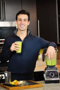 Lenny Gale with green smoothie and Vitamix Pro 750.